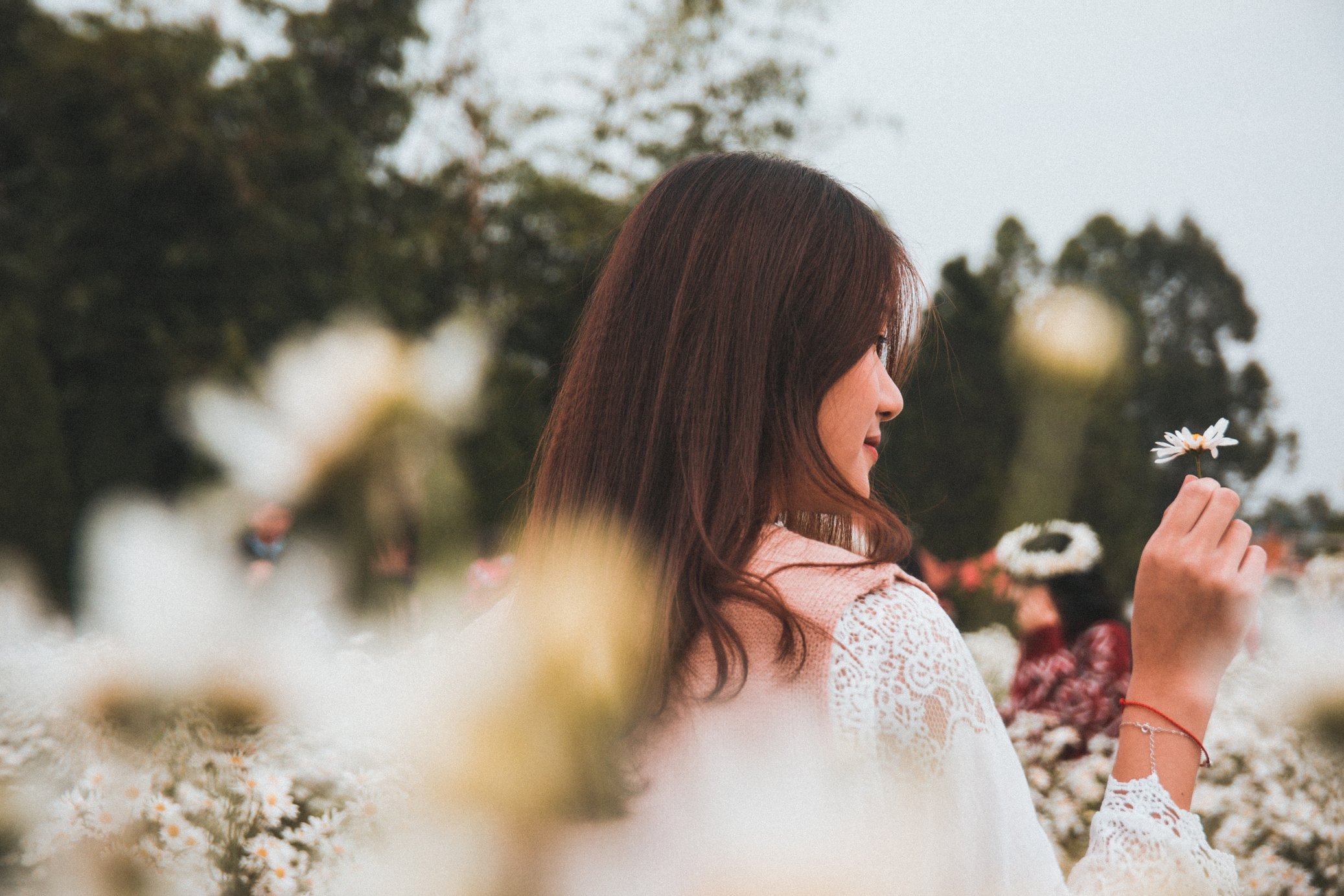 Woman Surrounded By Flowers